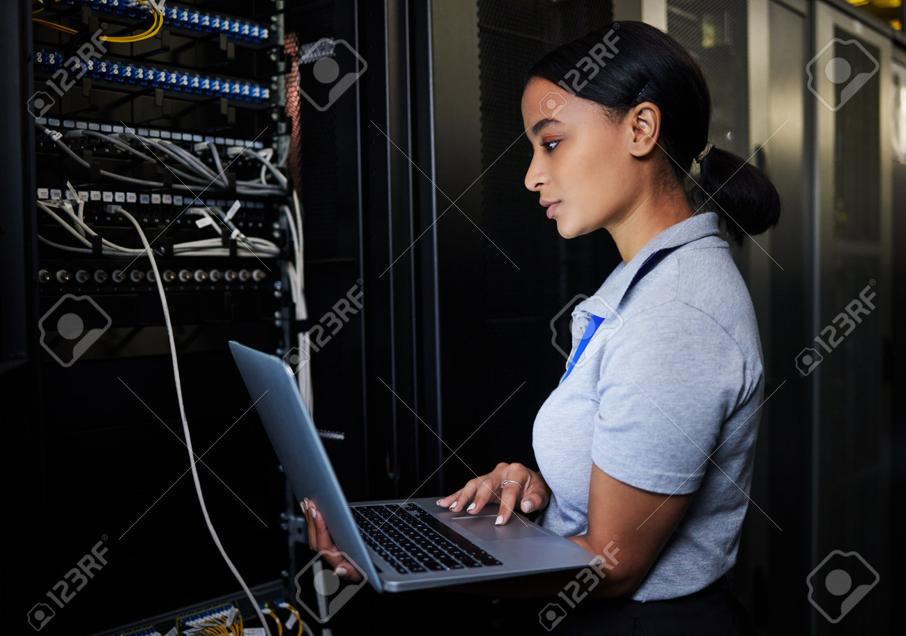 A women working on a server tower